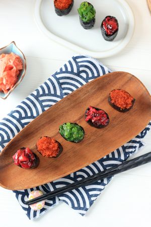 Gunkan Sushi on Oval Wooden Plate