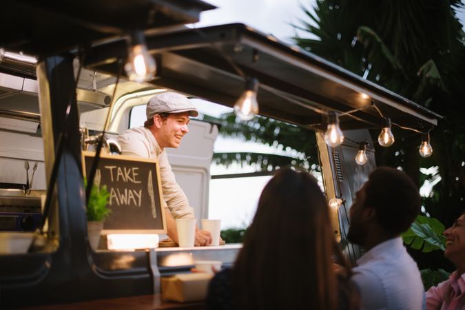 Happy vendor communicating with customers