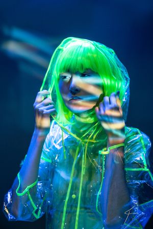 Asian woman posing in fluorescent light