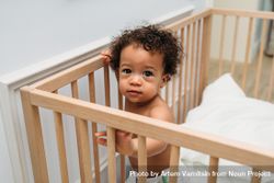 Baby boy in crib 5p1le4