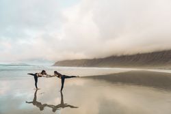 Women exercising near sea