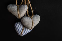 Felt heart decorations on dark background