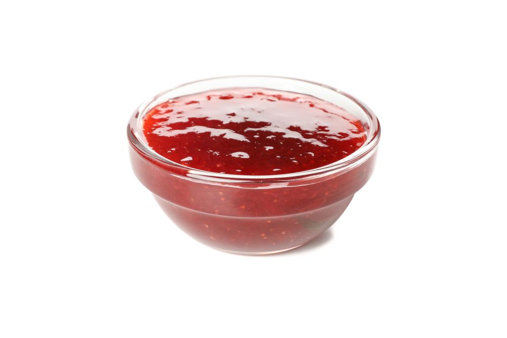 Delicious strawberry jam isolated on plain background