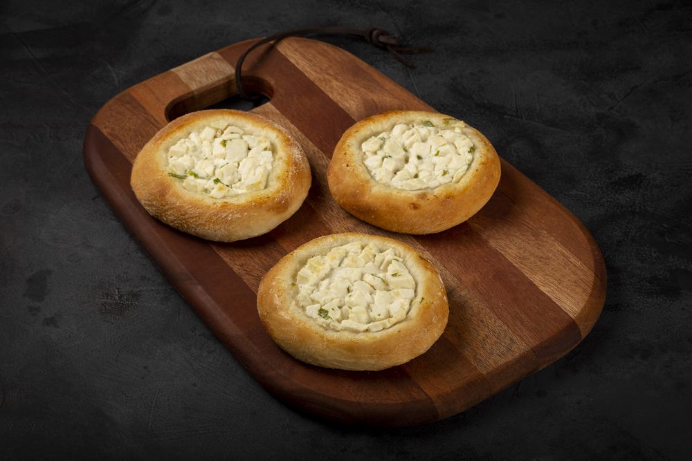 Arabic cheese sfiha on the table.