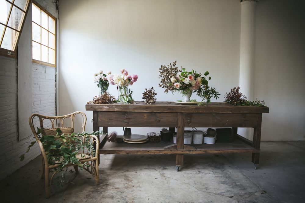 Bunches of flowers in vases on table