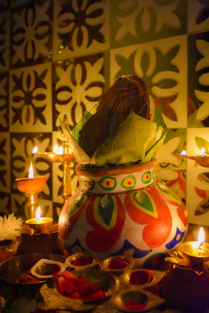 Colorful pottery surrounded by diyas