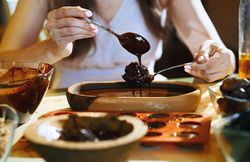 Staying at home woman preparing handmade vegetarian chocolate tart