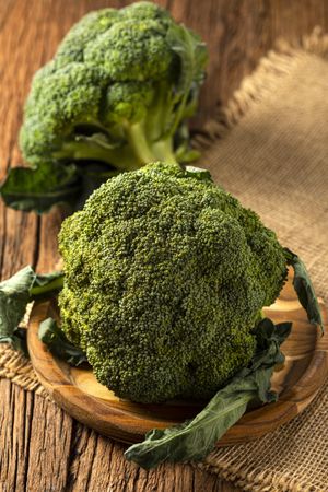 Green organic broccoli on the table.