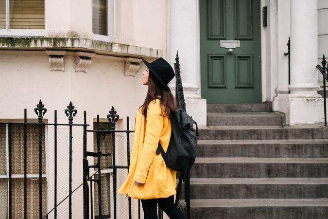 Female tourist looking at buildings on street