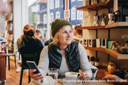 Woman in cosy cafe bEreV0