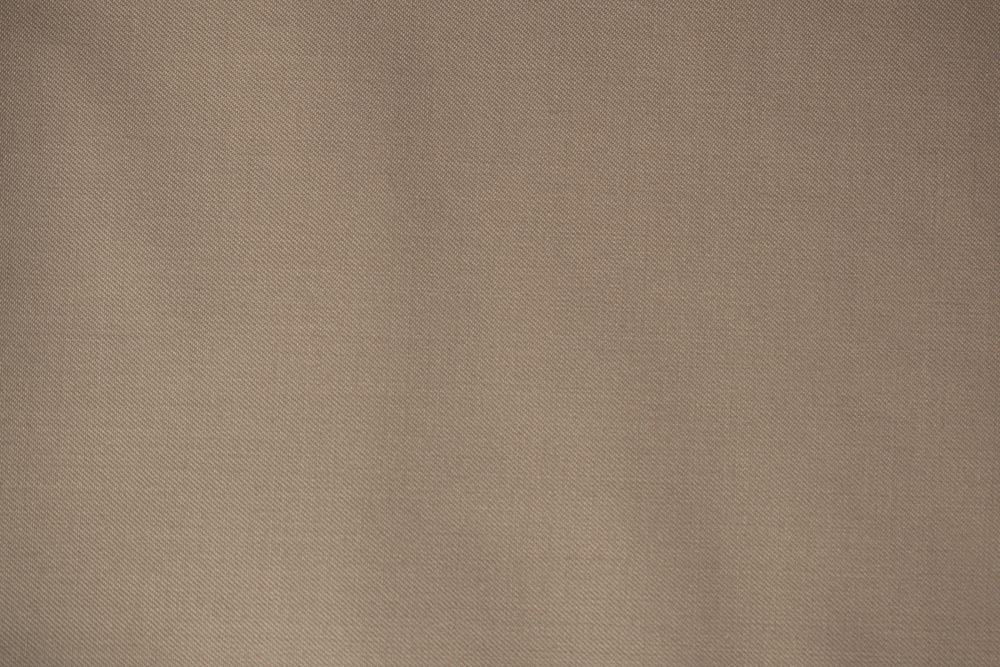 Detailed flat view Light brown pattern fabric texture background.