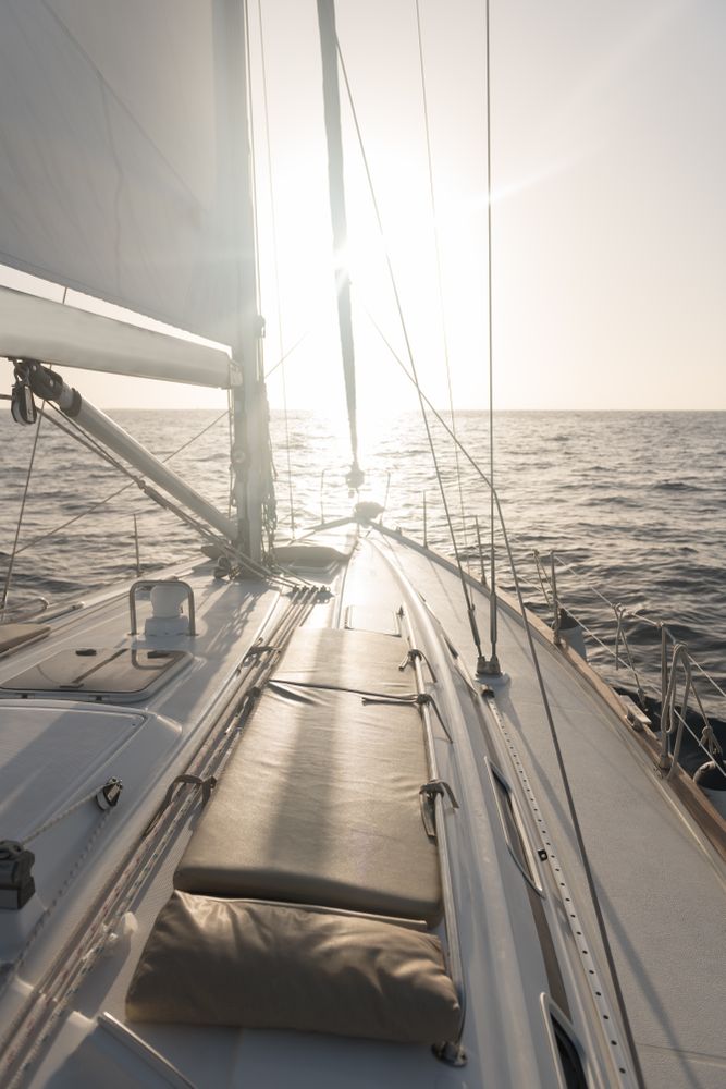 Seats on nose of yacht on water