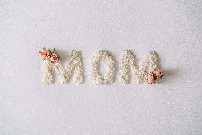 “MOM” text made with flower petals and leaves