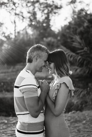 Happy couple looking at each other on beach