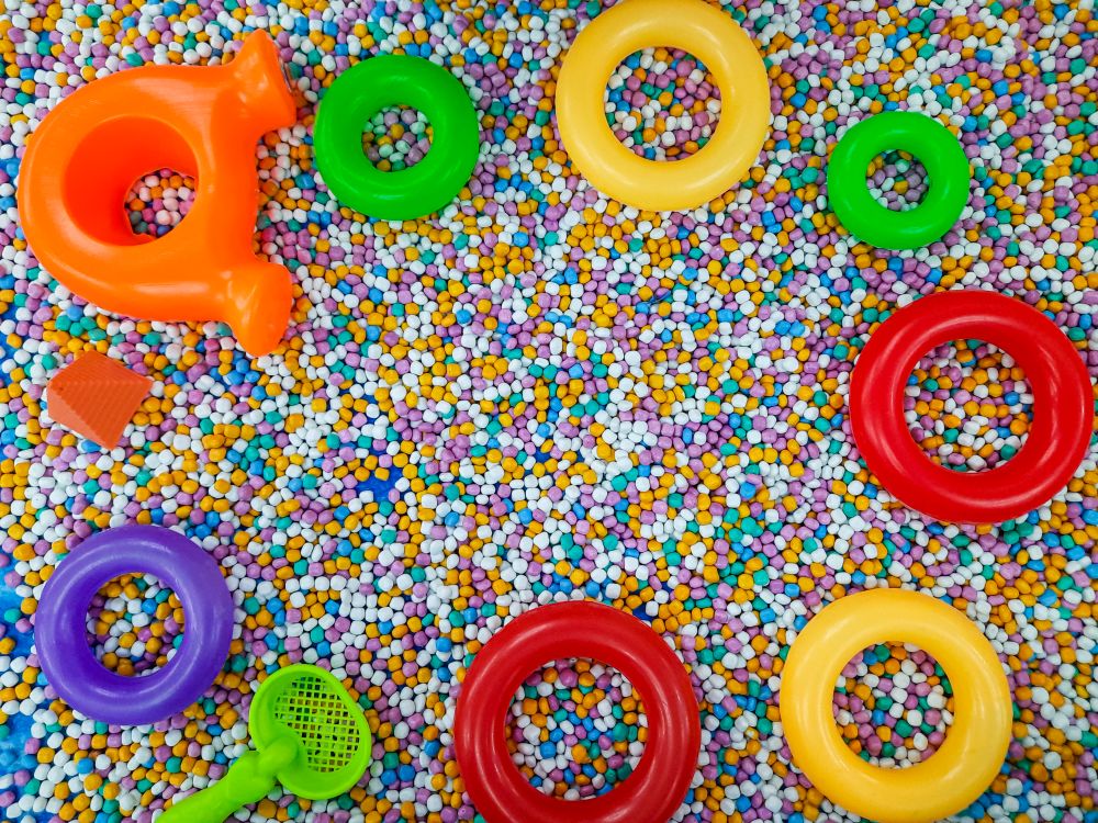 Toddler toys frame with copy space on colorful background