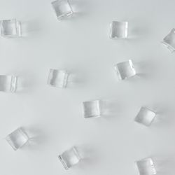 Ice cubes pattern on bright background