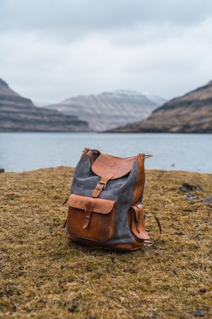 Briefcase on shore lake
