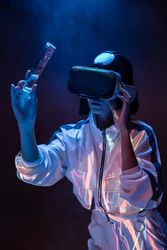 Woman touching air in VR glasses