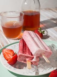 Refreshing strawberry popsicle on plate