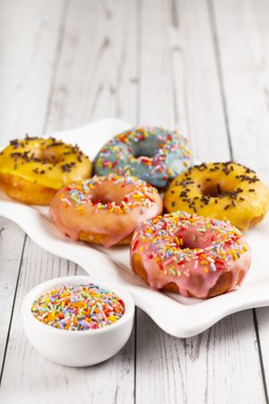 Delicious assorted colorful donuts on the table.