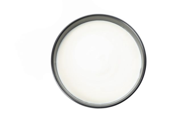 Bowl of sour cream yogurt isolated on blank background
