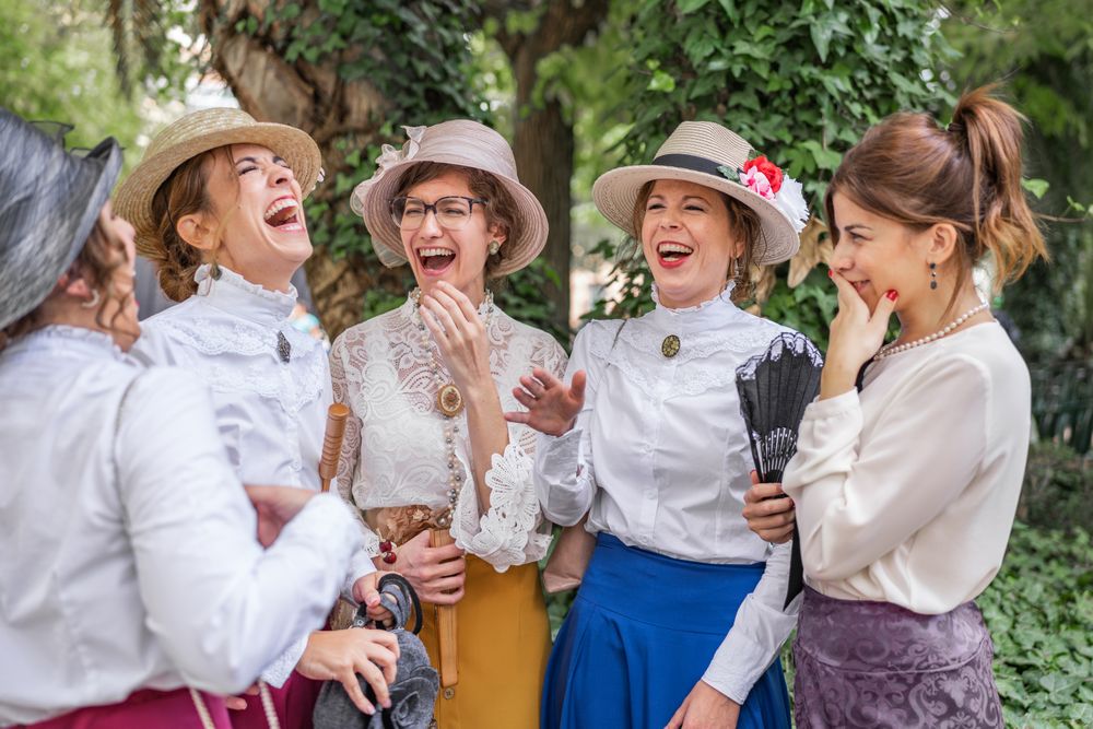 Vintage female friends speaking in garden