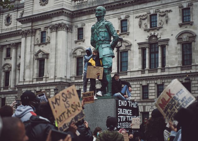 London, England, United Kingdom - June 6th, 2020: Protesters climb statue by Houses of Parliament
