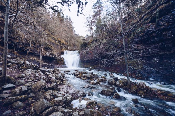 Cascade mountain river at autumn forest