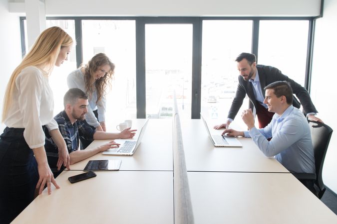 Group of colleagues working in contemporary office