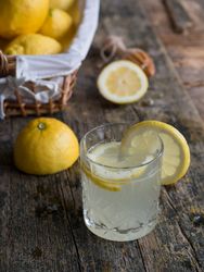 Glass cup with tasty lemonade