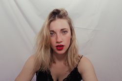 Stylish young blonde in trendy wear
