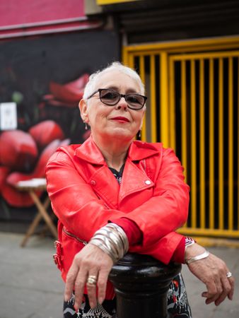 Older woman in red leather jacket