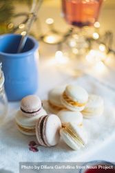 Festive macarons on table with string lights 4mNL7b