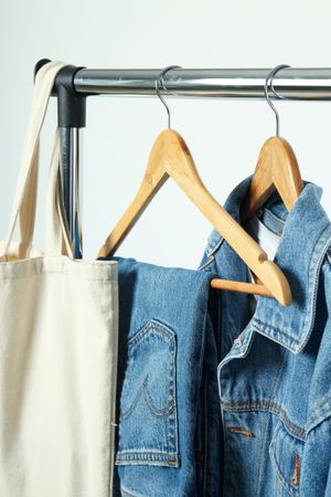 A denim suit on a hanger
