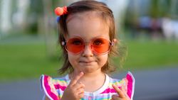 Toddler in sunglasses outdoors
