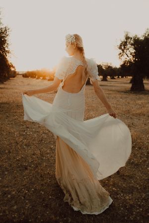 Woman in dress posing on nature