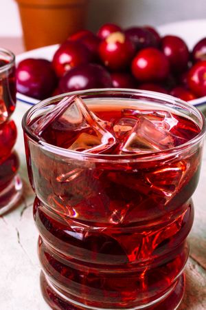 Red drink near fresh fruits