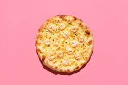 Shrimp pizza above view, isolated on a pink background