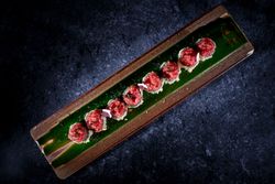 Delicious uramaki sushi rolls with raw tuna