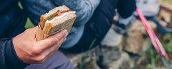 Sandwich that a couple is going to eat doing trekking