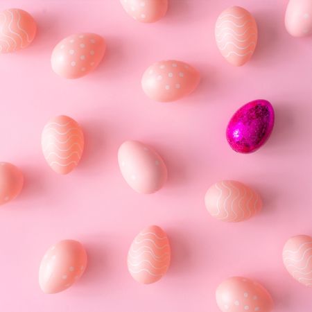 Pink Easter eggs on pink table