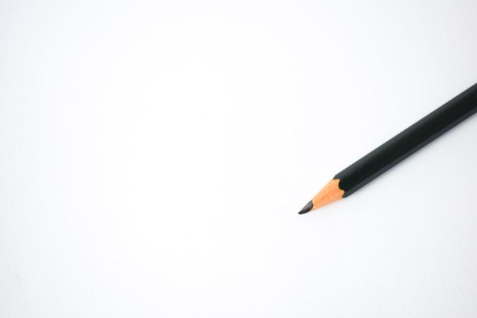 Sharpened pencil on table with copy space