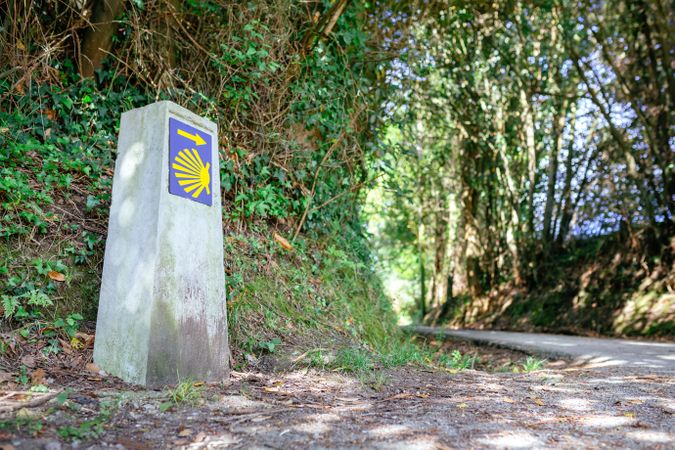 Milestone of Saint James way next to road