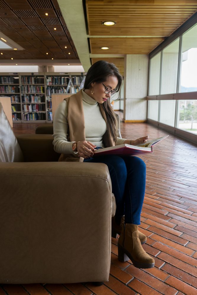 Woman in glasses reading a book