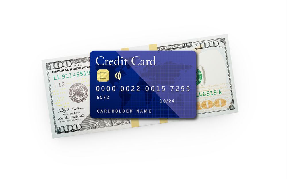 Ten Thousand Dollars Stack of One Hundred Dollar Bills with a Credit Card on Top