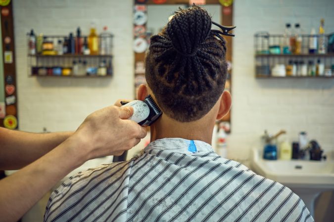 Anonymous hairstylist doing a haircut
