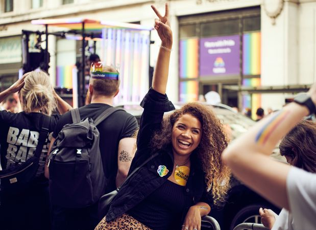 London, England, United Kingdom - July 7th, 2019: Woman making peace sign at Pride Parade