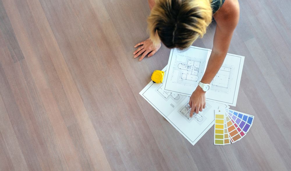 Young woman looking house plans