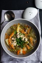 Top view of pasta and meat ball soup served on the table with copy space