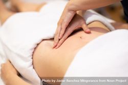 Physio massaging patient’s stomach 4dQjdb
